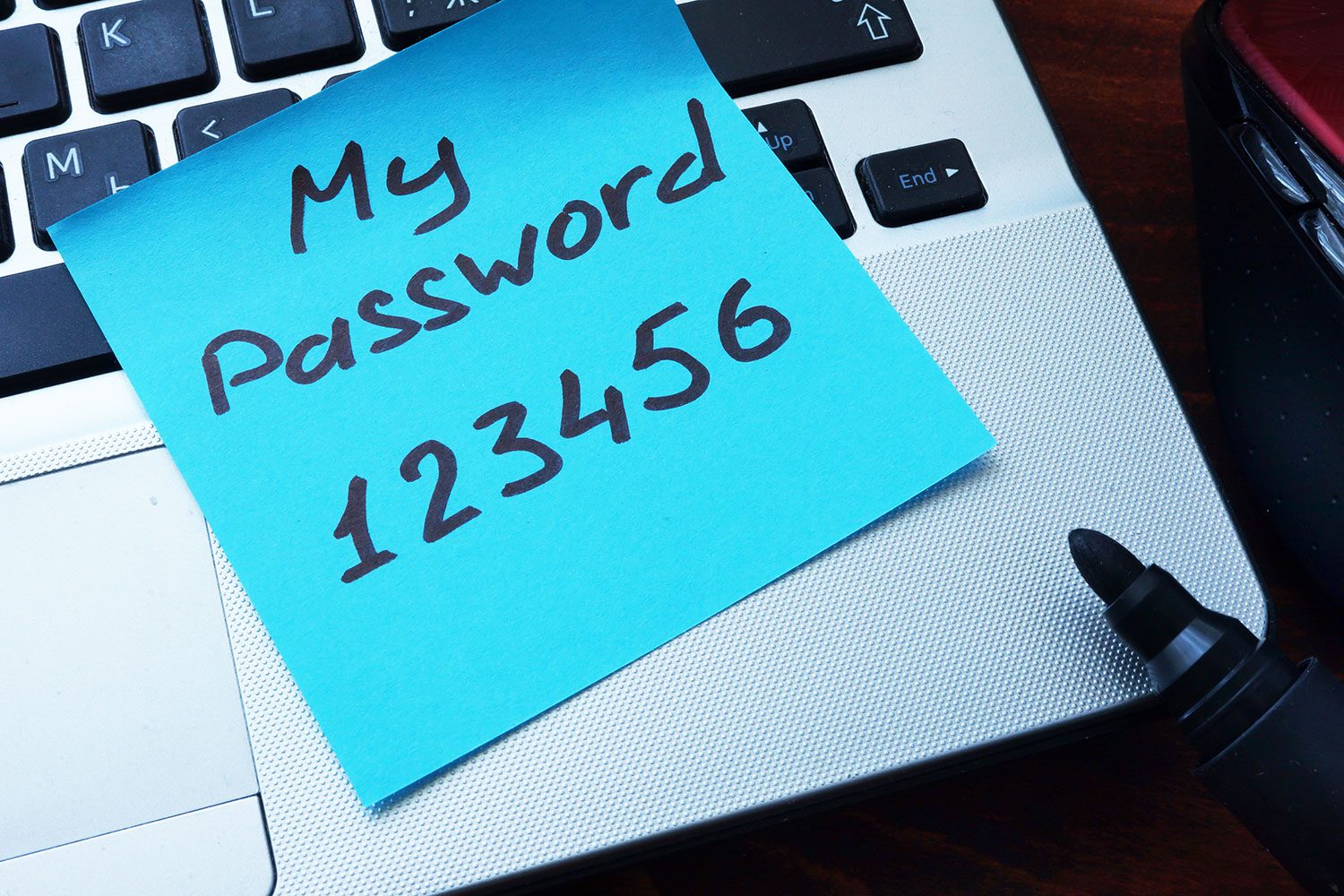 postit note of someones laptop password