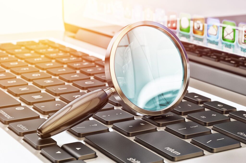 magnifying glass on a keyboard