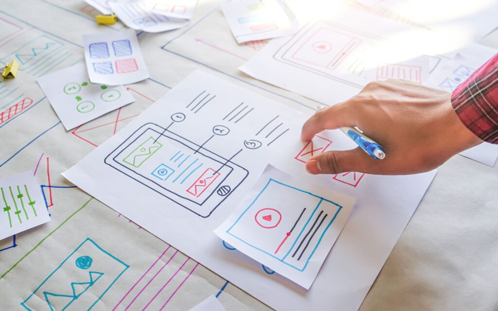 Diagrams, hand with pen in it pointing at diagrams