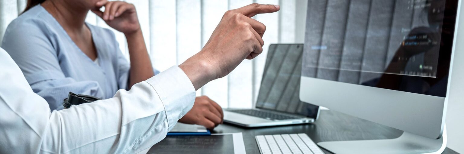 computer screen hand pointing at it